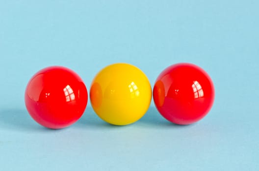 three colorful billiards balls on azure background