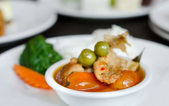 Red curry with roast duck served with vegetable   and rice vermicelli
