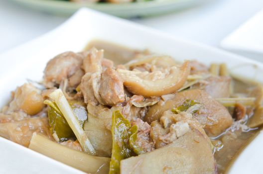 stewed pork knuckle with vegetable and herb , asian style food