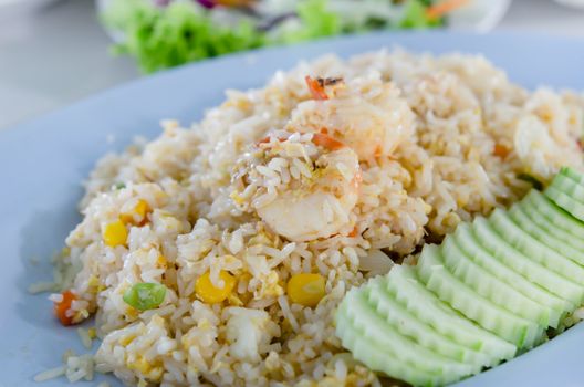 fried rice and  shrimp served with fresh cucumber , asian cuisine