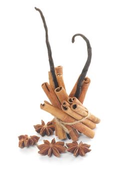Arrangement of Cinnamon Sticks, Anise Star and Vanilla Pods isolated on white background