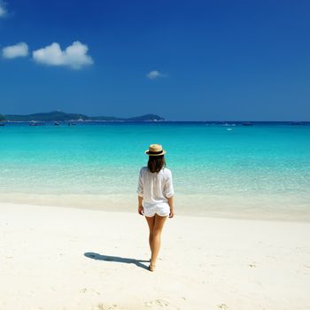 Woman in hat at beach