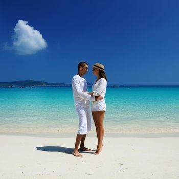 Couple in white on a tropical beach