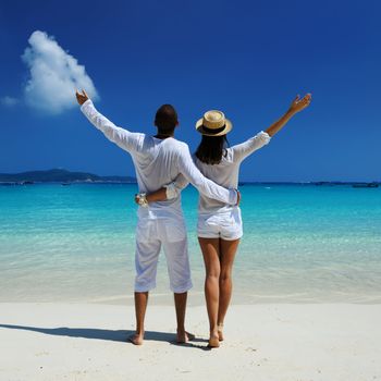 Couple in white on a tropical beach