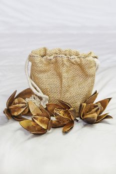 Vertical take of an arrangement of Cotton Squares and Hessian Bag oven a quilted sheet. Shot location of this generic capture, Bangalore studio, India