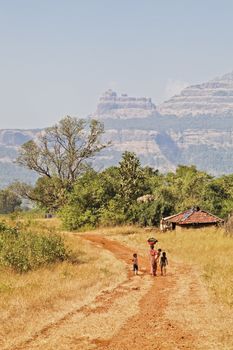 In the valley of the Sahyadhri mountains in Maharashtra India, contented families live and work as they have done for centuries, without electrical power or running water. Recycling, living of the land harvest and eco system where ever possible and almost everything is biodegradable.