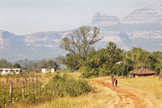 In the valley of the Sahyadhri mountains in Maharashtra India, contented families live and work as they have done for centuries, without electrical power or running water. Recycling, living of the land harvest and eco system where ever possible and almost everything is biodregadeable.