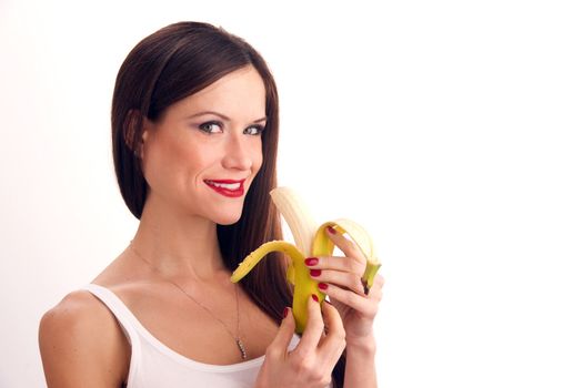 Attractive  Woman eats RAW banana