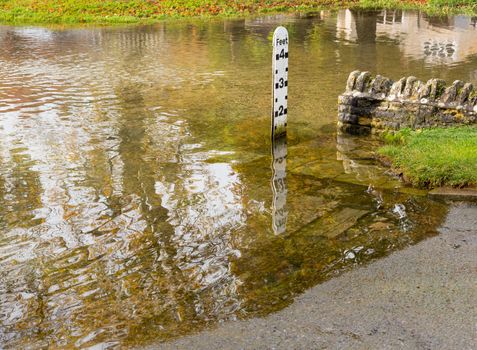 Depth gauge at deep river at road ford on Shill Brook at Shilton Oxfordshire
