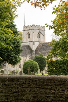 Church of Minster Lovell in Cotswold village with graveyard