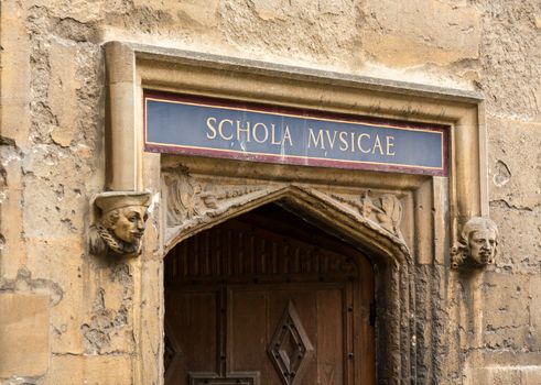 Carved wooden door at entrance to School of Music at Bodeian Library University of Oxford