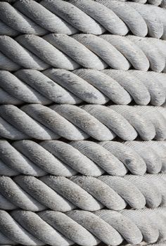 Weathered nautical rope, closeup as nautical background and horizontal texture.