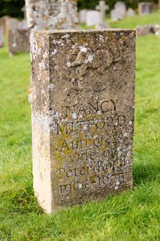 SWINBROOK, ENGLAND - OCTOBER 20: Gravestone for Nancy Mitford, famous Author. She died on 30 June 1973 and was buried in Swinbrook.