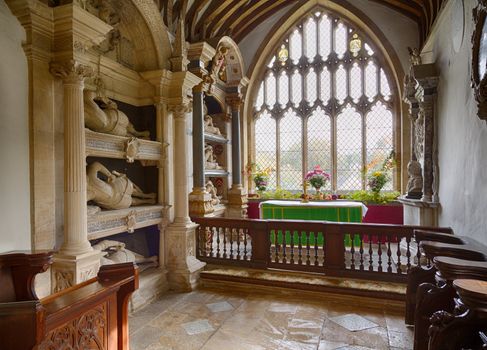 Parish Church of St Mary in Swinbrook Oxford with unusual statues of knights by altar