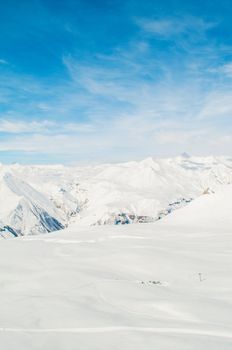 Snow mountains on bright winter day