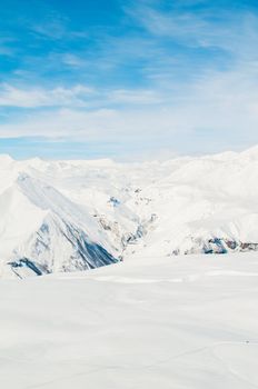 Snow mountains on bright winter day