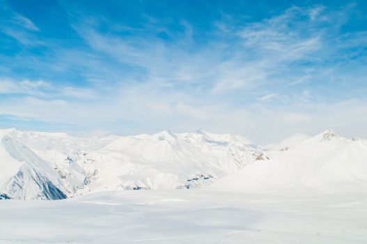 Snow mountains on bright winter day