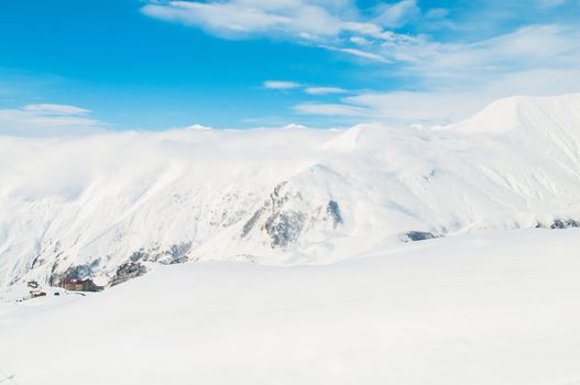Snow mountains on bright winter day