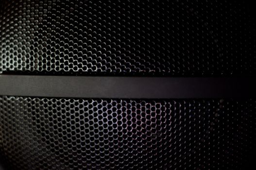 close-up of a loud speaker grille structure