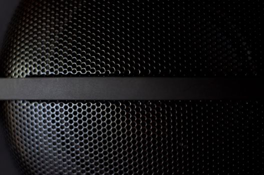 honeycomb structure of a side-lit black speaker 