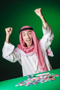 Arab playing in casino - gambling concept with man