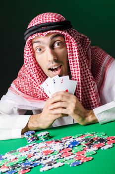 Arab playing in casino - gambling concept with man