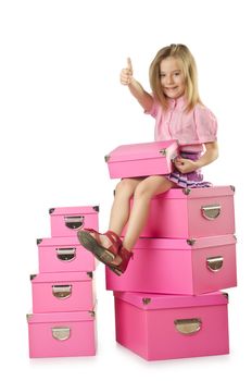 Little cute girl with lots of boxes
