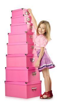 Little cute girl with lots of boxes