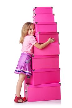 Little cute girl with lots of boxes