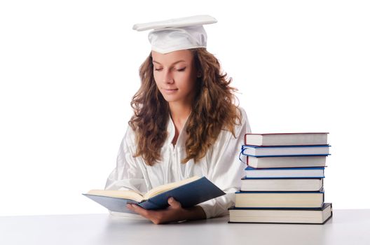 Happy graduate with lots of books on white