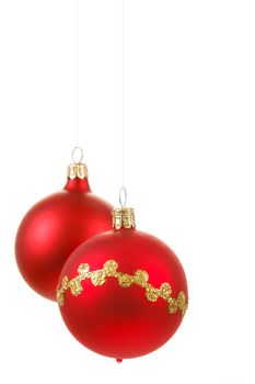 tho red christmas balls on white background