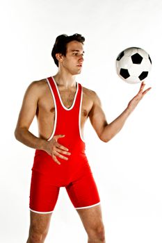 Young and handsome man with a soccer ball gymnast