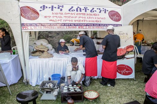 Addis Ababa â  November 18: Restaurants and caterers prepare local and international cuisines for the palates of Addis Ababa residents attending the 2012 Taste of Addis food festival on November 18, 2012 in Addis Ababa, Ethiopia