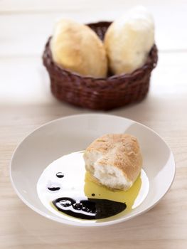 close up of bread in olive oil balsamic vinegar dip