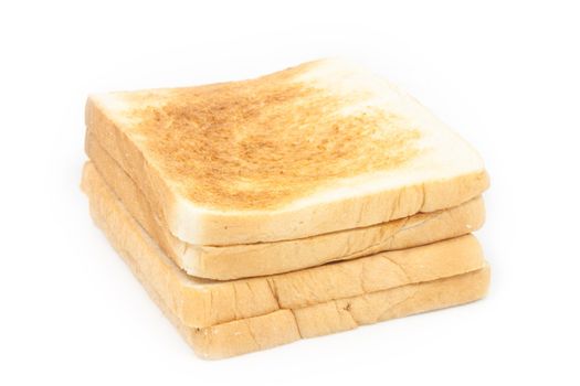 Stack of toasted bread on white background