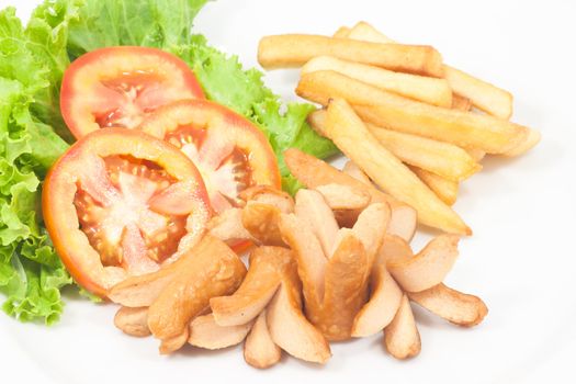 Fries sausage with French fries and vegetables on white background