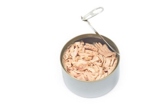 Tuna in vegetable oil in opened can on white isolated