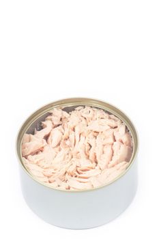 Tuna in vegetable oil in opened can on white isolated