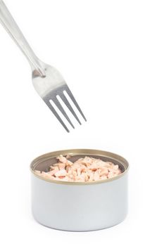 Tuna in vegetable oil with fork on white