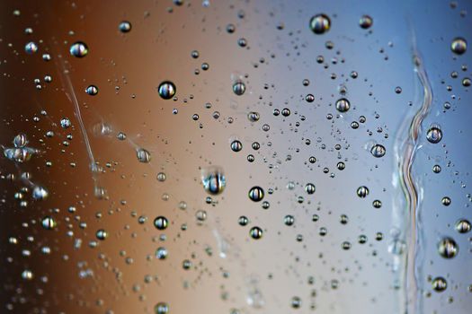 Macro picture of water droplets on window, shallow DOF