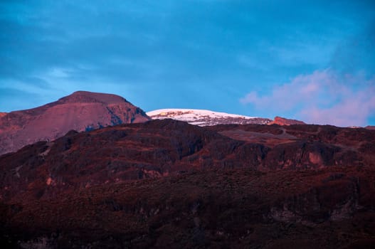 Mountains taking on a purple color in the late afternoon light.