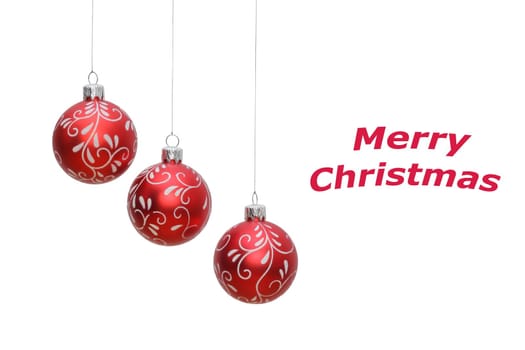 three hanging red christmas balls on white background, place for text