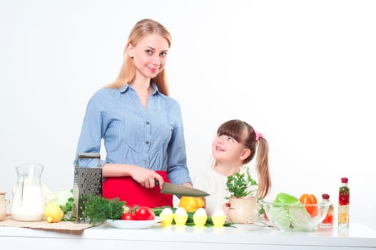Mother and daughter cooking together, help children to parents