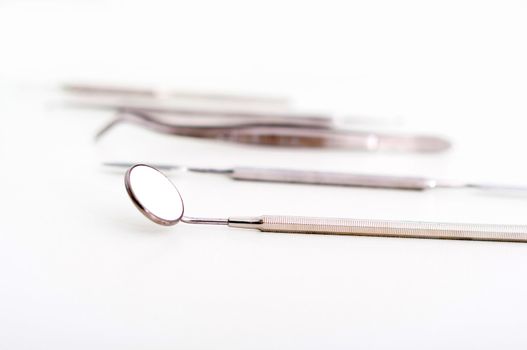 collection of medical instruments, on a light background