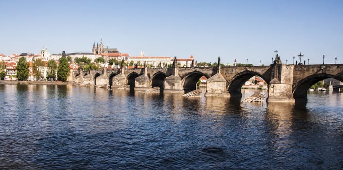 view of the Charles Bridge on the Vltava river in Prague