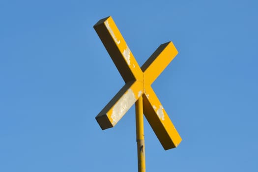 Yellow Cross with Blue sky background