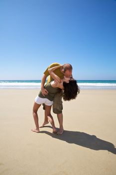 kissing couple at sandy beach in Cadiz Andalusia Spain