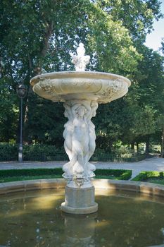 antique fountain at El Retiro public park in Madrid Spain
