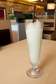 Lime juice in tall glass in restaurant