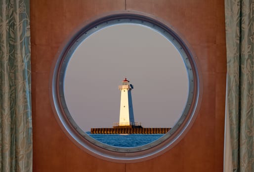 Sodus Bay Lighthouse on Lake Ontario as seen through a porthole. 